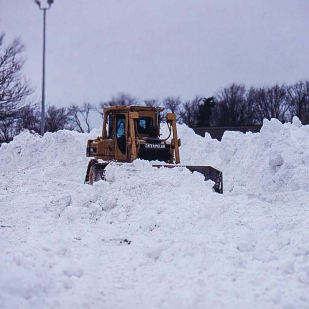 Snow covering a Bucks County commercial parking lot after a winter storm