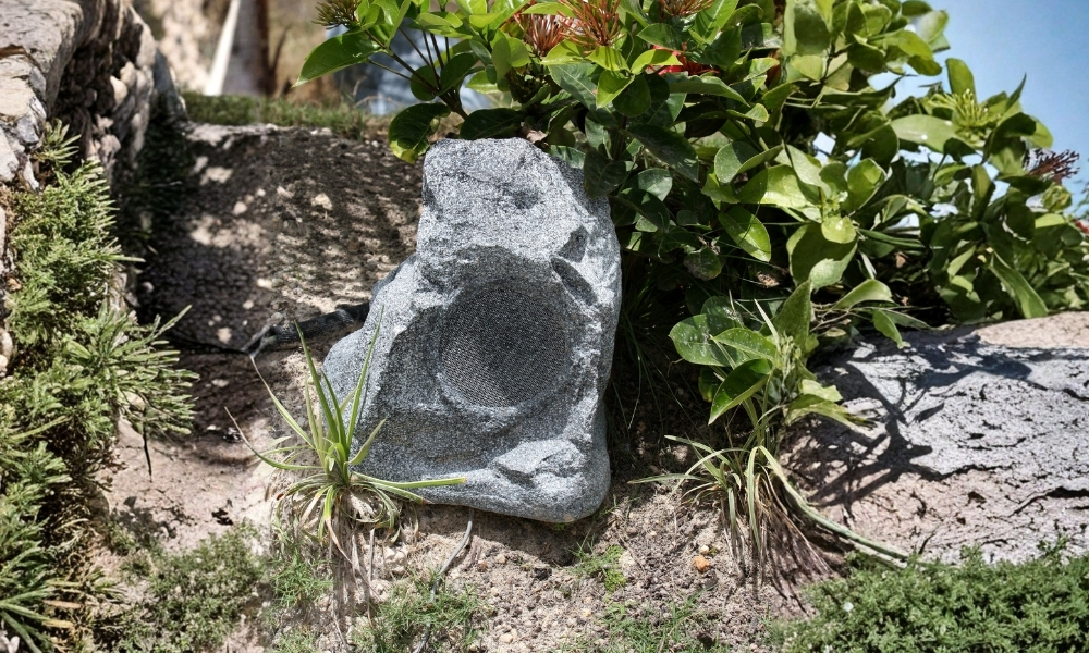 Weather-resistant hidden outdoor speakers installed by The Lingo Group surviving Pennsylvania four-season climate in Bucks County