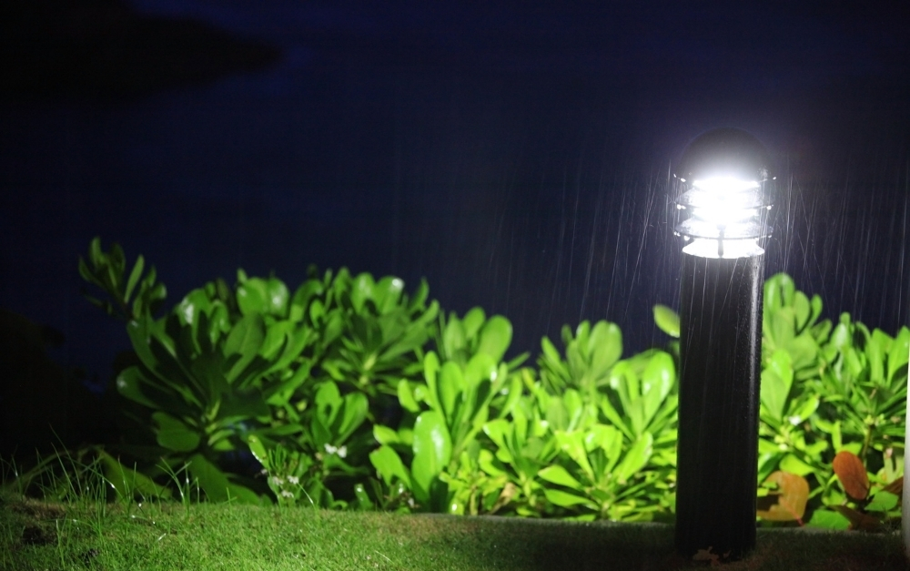 Elegant outdoor wall lights illuminating a luxury Bucks County home facade at night
